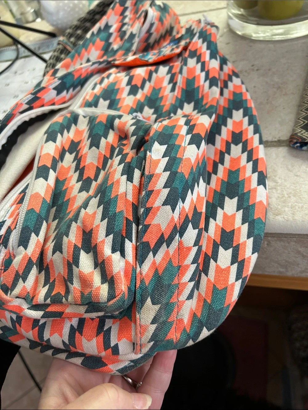 Kavu Chevron Sling Backpack in Coral, Teal & White With Wallet